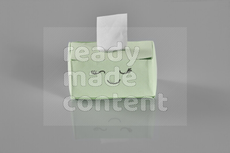 Origami tissue box on grey background