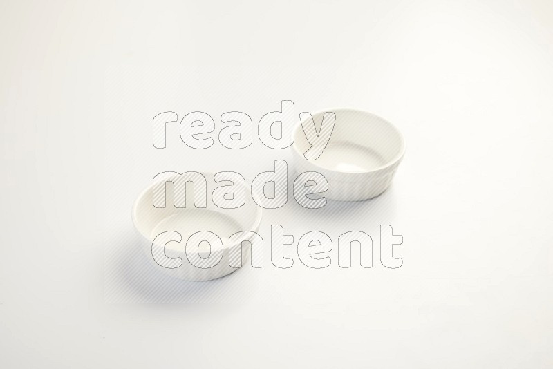 white ceramic round sauce dish on white countertop