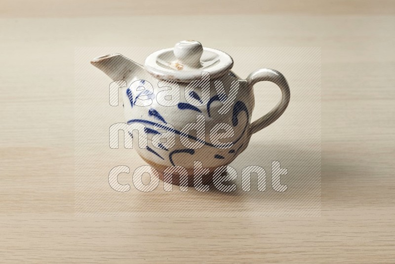 Pottery teaPot on Oak Wooden Flooring, 15 degrees