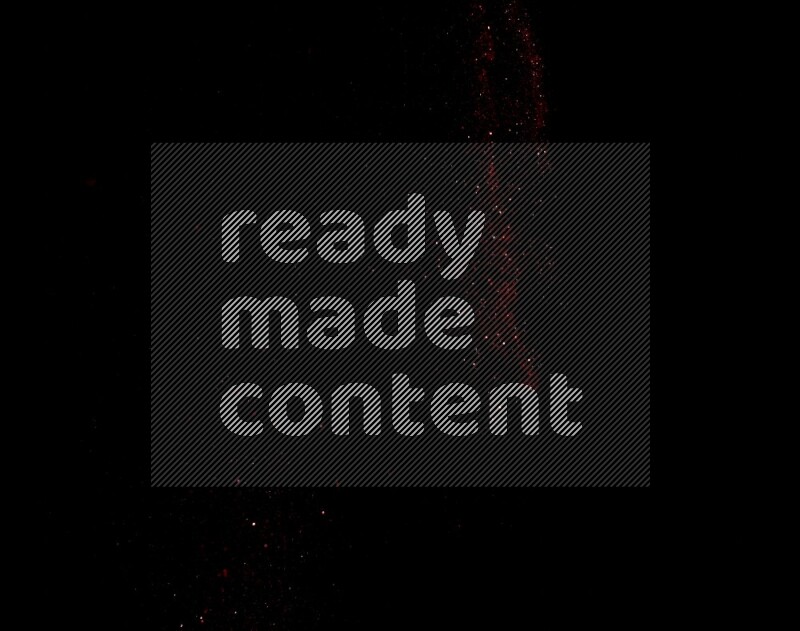 Red glitter powder isolated on black background