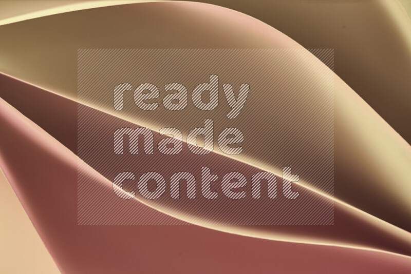 This image showcases an abstract paper art composition with paper curves in gold gradients created by colored light