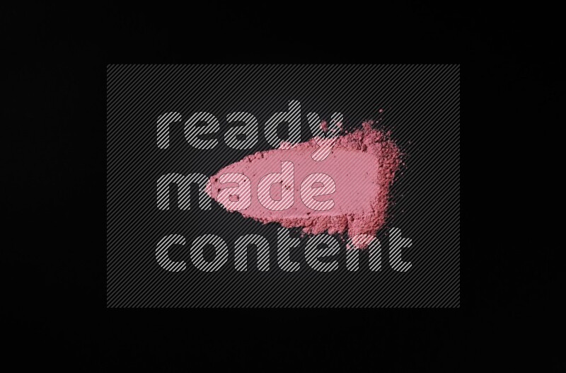Red powder strokes on black background