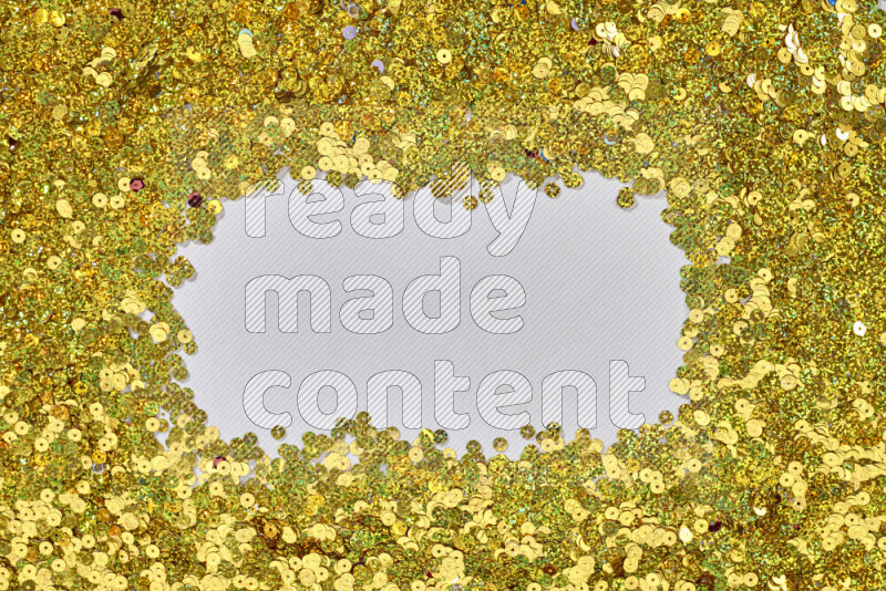 Multicolored flat sequins on grey background