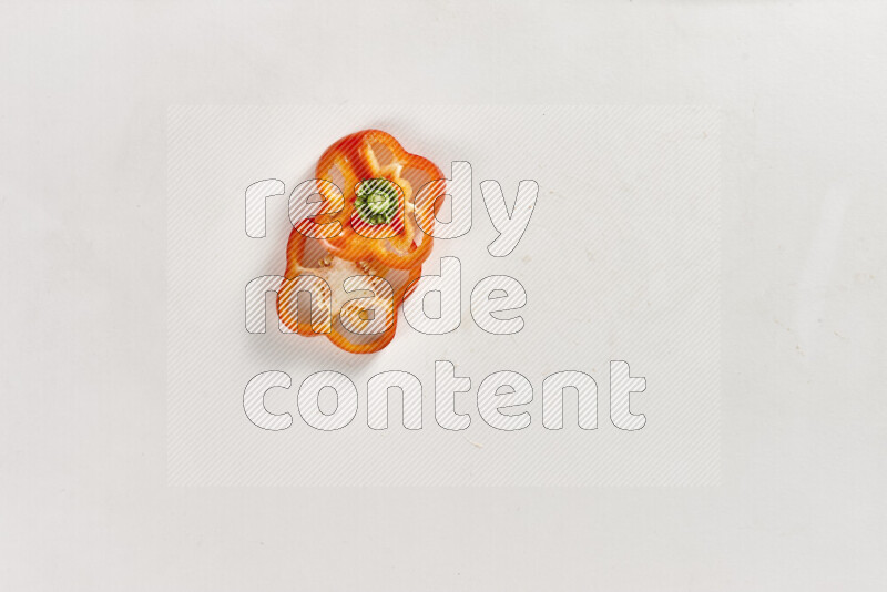 Red bell pepper slices on white background