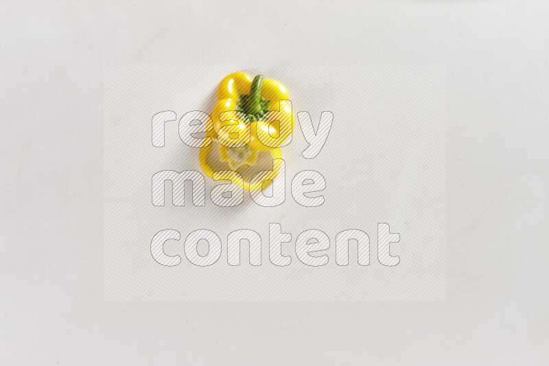 Yellow bell pepper slices on white background