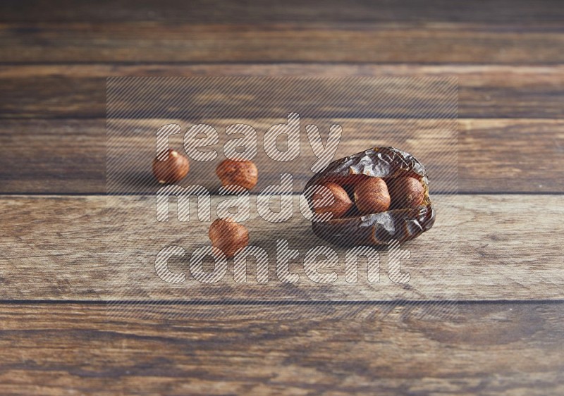hazelnut stuffed madjoul date on a wooden background