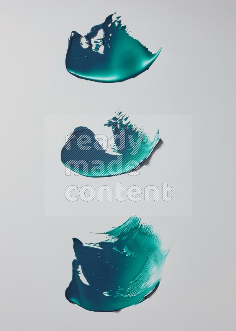 Turquoise painting knife strokes on white background