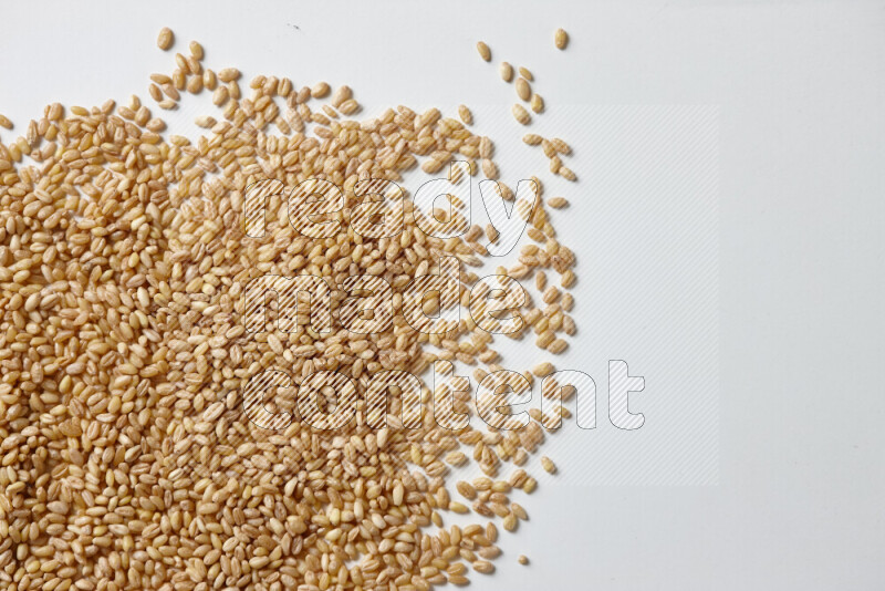 Hulled wheat on white background