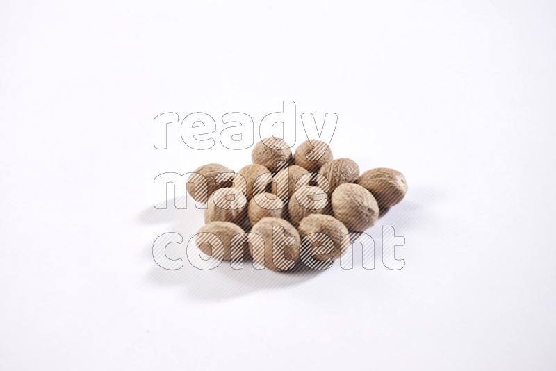 Nutmeg on a white flooring in different angles