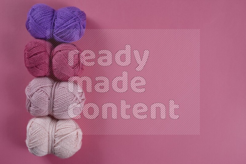 A purple and pink collection of sewing and tailoring tools arranged on a pink background