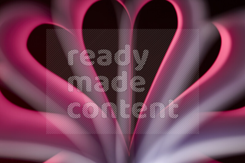 An abstract art piece displaying smooth curves in pink gradients created by colored light