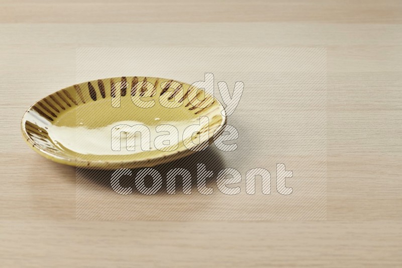 Multicolored Pottery Plate on Oak Wooden Flooring, 15 degrees