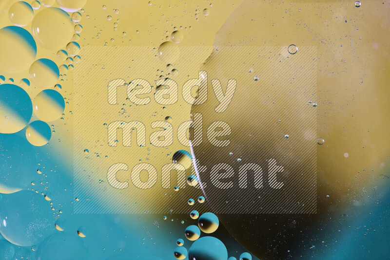 لقطات مقربة لفقاعات من الزيت على سطح الماء باللون الأزرق والأصفر