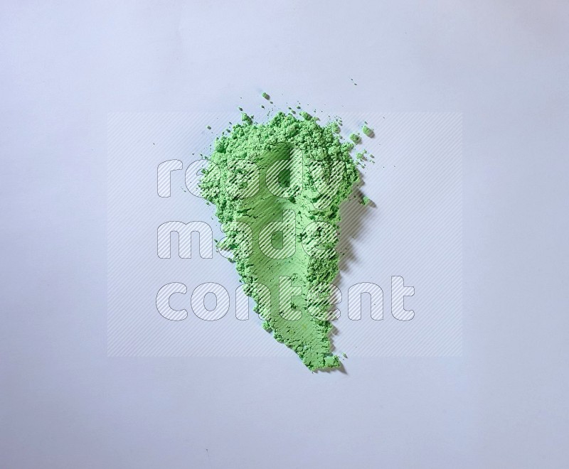 Green powder strokes on white background