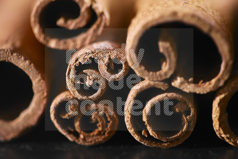 Cinnamon sticks on black background