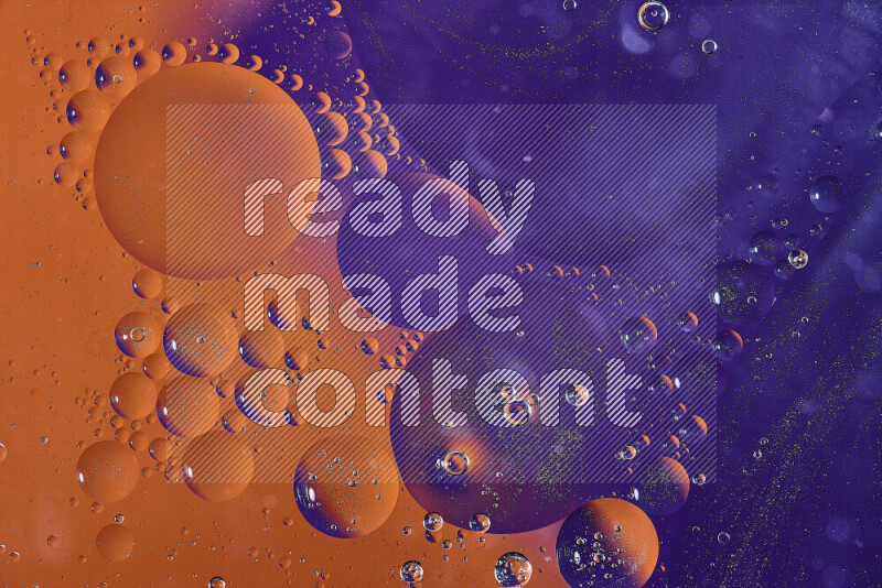 Close-ups of abstract oil bubbles on water surface in shades of orange and purple