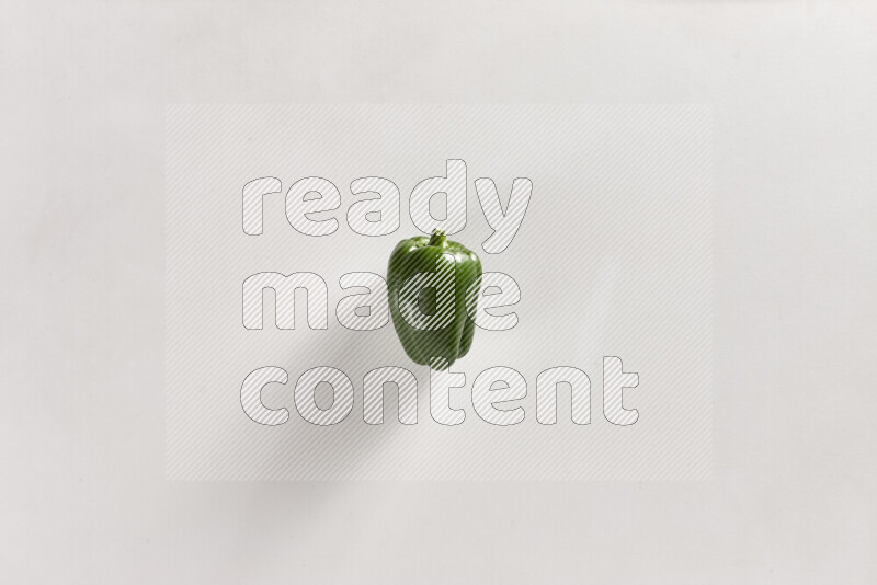 Green bell pepper on white background