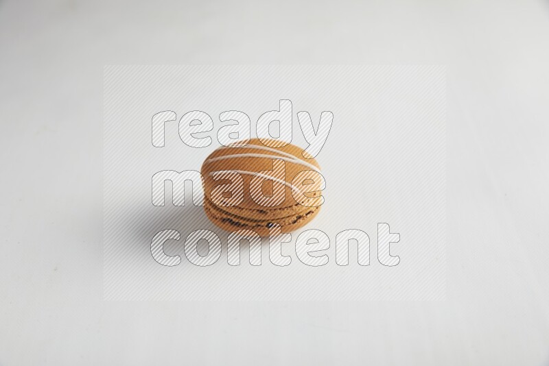 45º Shot of Brown Irish Cream macaron on white background