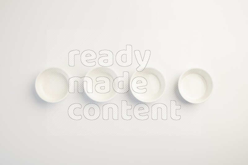white ceramic round sauce dish on white countertop