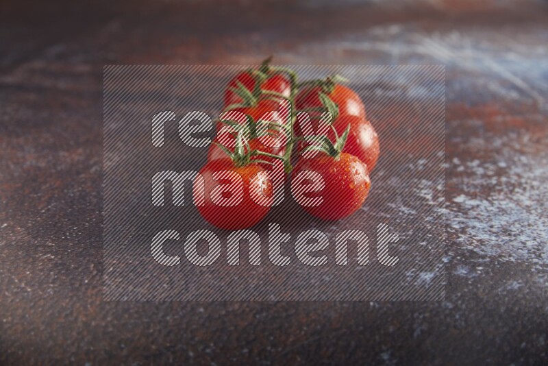 red cherry tomato vein on a reddish rustic metal background 45 degree