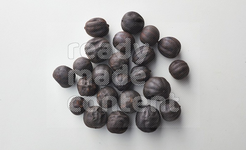 Top-view shot of dried lime (loomi) on white background