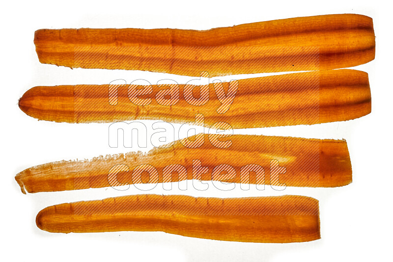 Carrots slices on illuminated white background