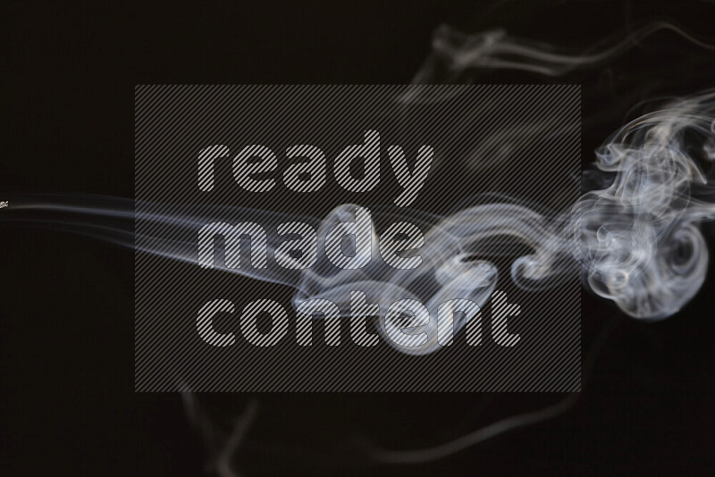 Motion of wavy smoke isolated on dark background