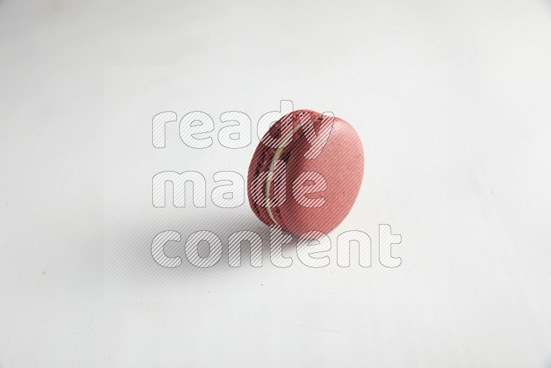 45º Shot of Red Velvet macaron on white background