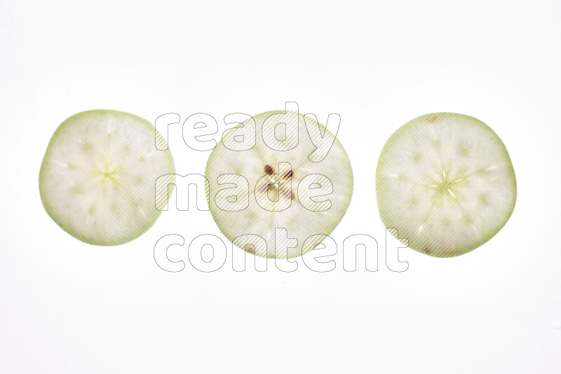 Apple slices on illuminated white background