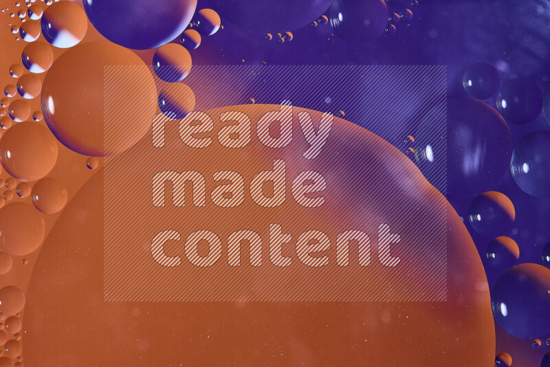 Close-ups of abstract oil bubbles on water surface in shades of orange and purple