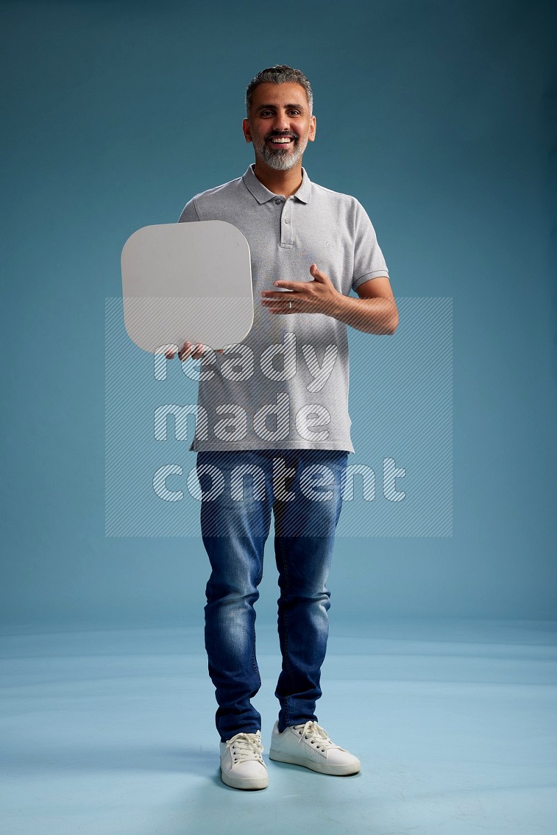 Man Standing holding social media sign on blue background