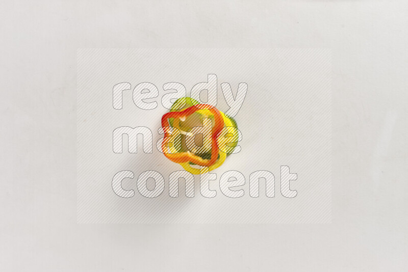 Assorted bell pepper slices on white background