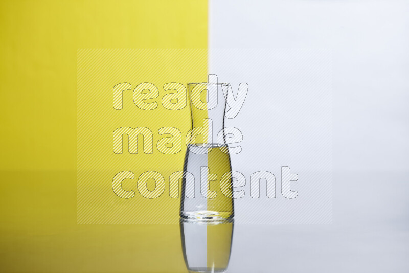 The image features a clear glassware filled with water, set against white and yellow background