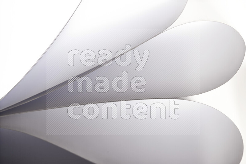 An abstract art showing grey paper sheets arranged in an overlapping curves
