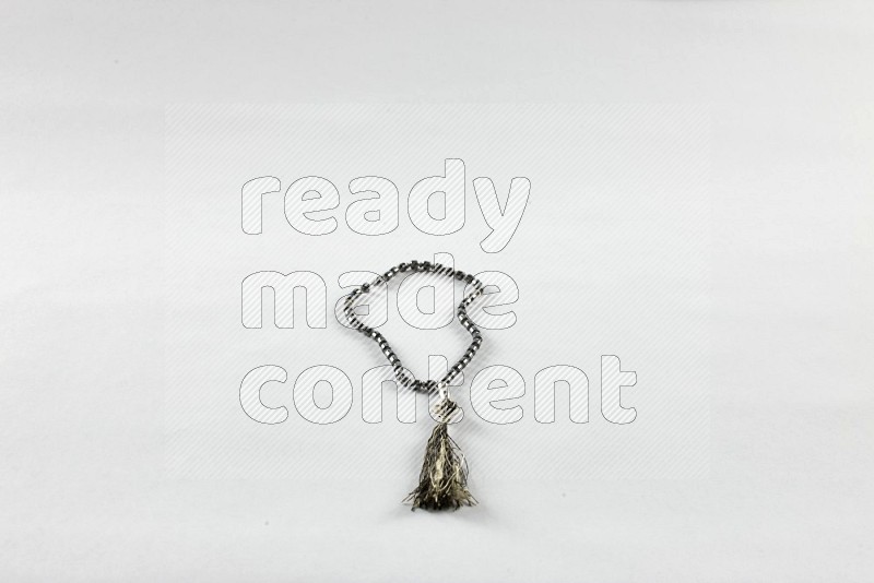 Prayer beads on white background