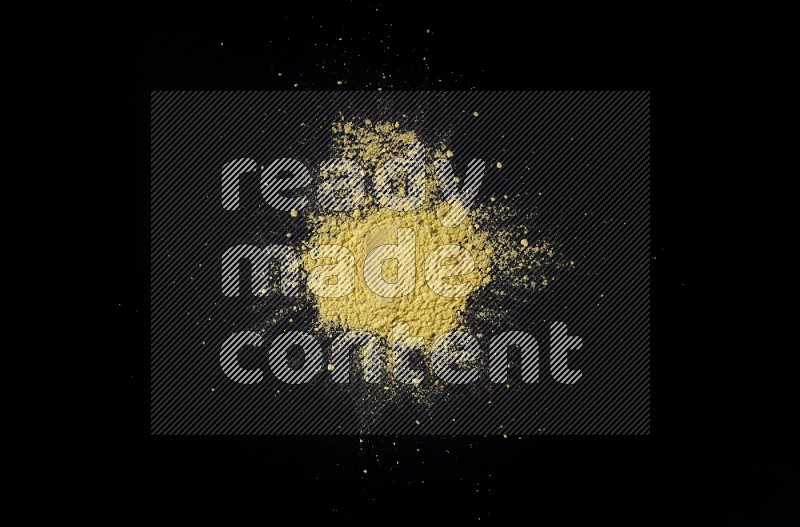 Yellow powder on black background