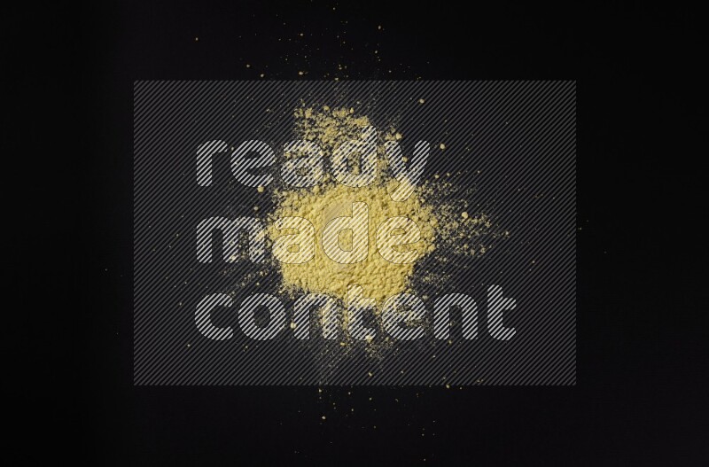Yellow powder on black background