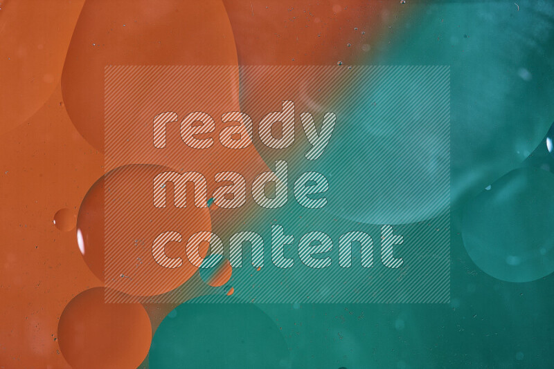 Close-ups of abstract oil bubbles on water surface in shades of green and orange