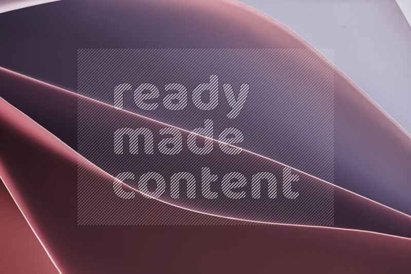 هذه الصورة تعرض تكوين فن الورق التجريدي مع منحنيات ورقية بتدرجات لونية دافئة مختلفة المكونه بواسطة الضوء الملون