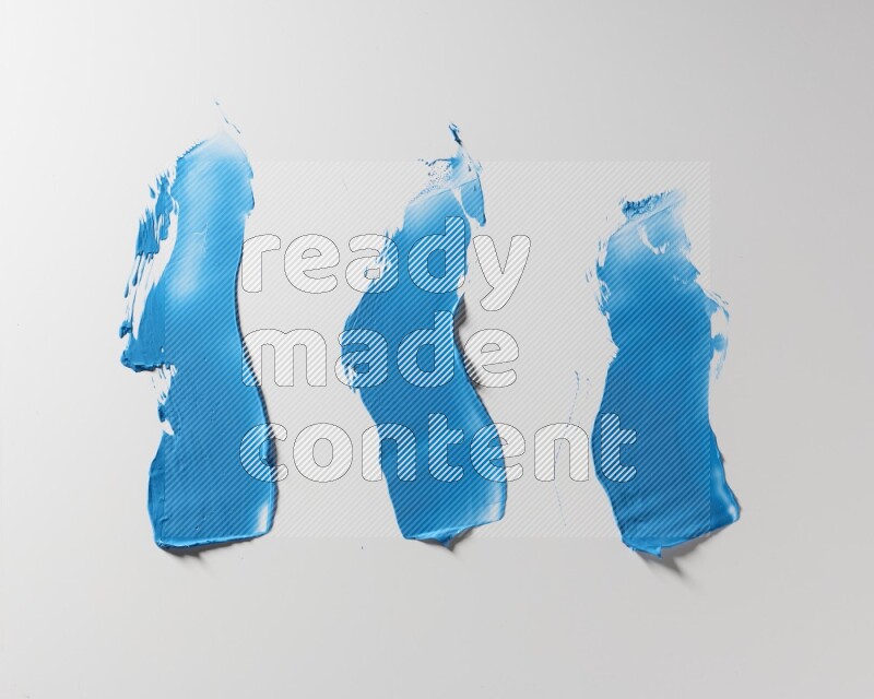 Blue zigzag painting knife strokes on white background