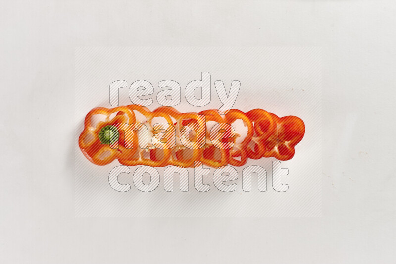 Red bell pepper slices on white background