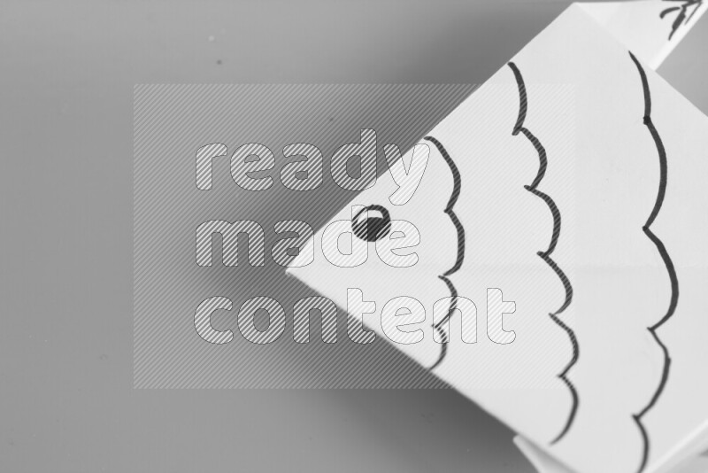 Origami fish on grey background