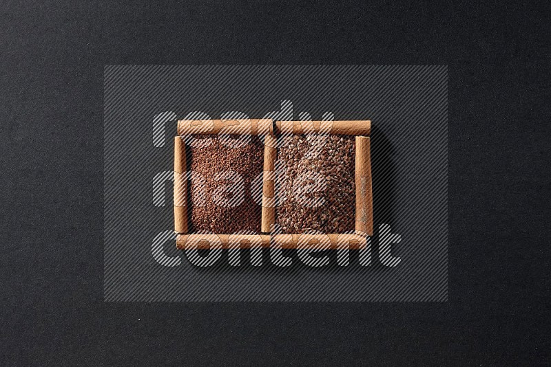 2 squares of cinnamon sticks full of garden cress and flaxseeds on black flooring