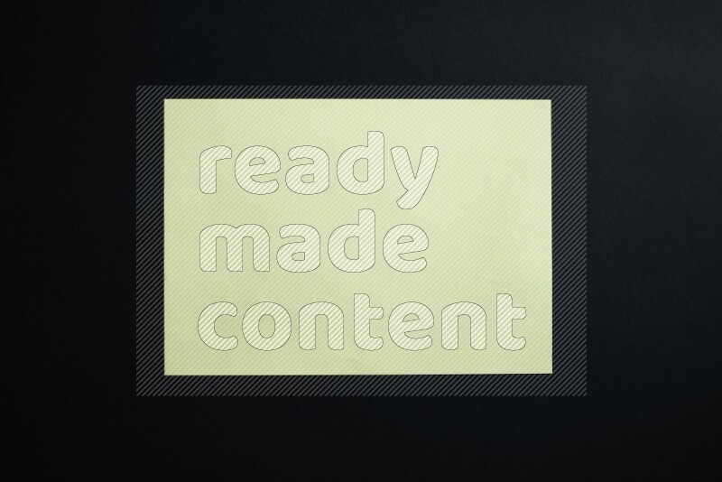 Yellow paper sheet on black background