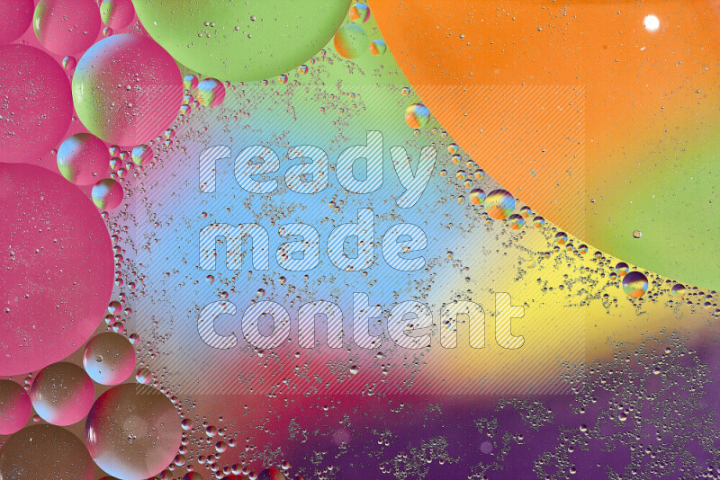 Close-ups of abstract oil bubbles on water surface in multicolors