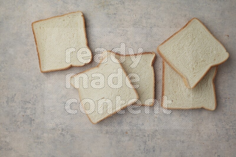 White Toast slices on alight blue textured background
