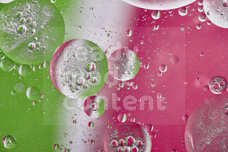 Close-ups of abstract oil bubbles on water surface in shades of pink, green and white