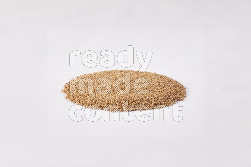 Mustard seeds in a circle shape on a white flooring