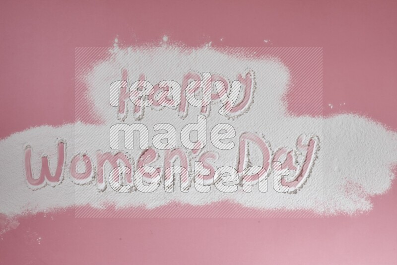 A sentence written with powder on pink background