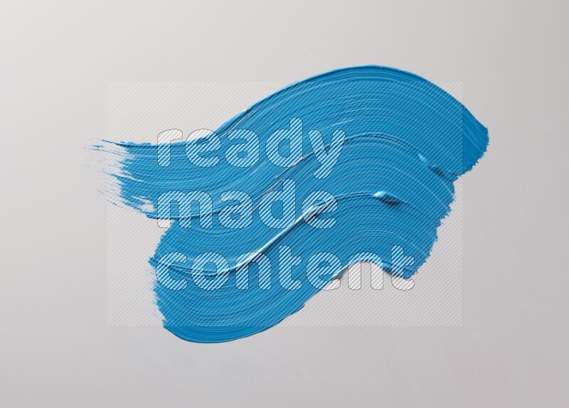 Multi blue curved brush strokes shaped into different shapes on a white background